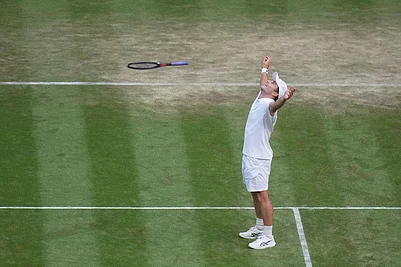 | Photo: AP/Brian Inganga : Arthur Fery of Britain celebrates winning against Grigor Dimitrov of Bulgaria in their fourth round mens singles match at the Wimbledon Tennis Championships in London.