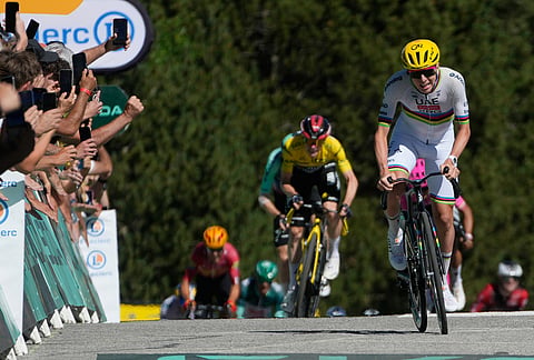 Slovenia's Tadej Pogacar sprints to cross the finish line of the third stage of the Tour de France cycling race with start in Granollers and finish in Les Angles , France, Monday, July 6, 2026.