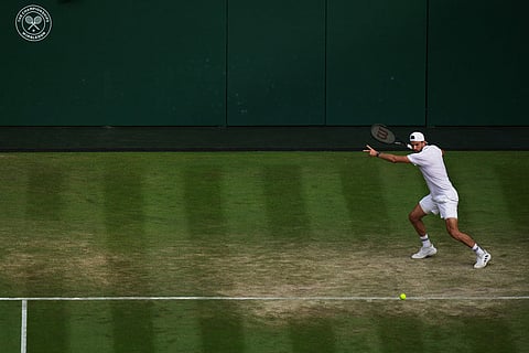 Grigor Dimitrov of Bulgaria returns the ball to Arthur Fery of Britain in their fourth round men's singles match at the Wimbledon Tennis Championships in London.