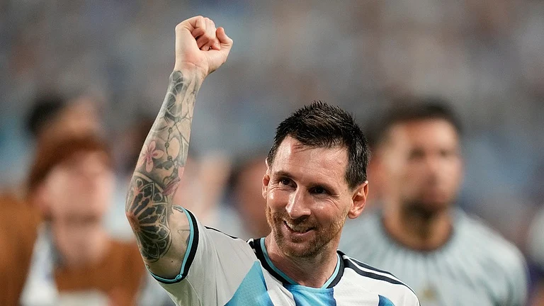 Argentina's Lionel Messi, center, celebrates after the World Cup round of 32 soccer match against Cape Verde in Miami Gardens - Rebecca Blackwell/AP Photo