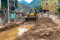 | Photo: PTI : Rescuers are searching mud-covered sites in Nepal and Tibet after deadly flash floods swept through the Himalayan border region.