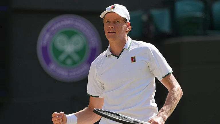 Jannik Sinner of Italy celebrates his victory against Jan-Lennard Struff of Germany in the quarter-final men's singles competition of the Wimbledon Tennis Championships in London. - Kin Cheung/AP Photo