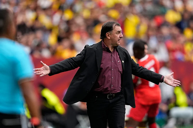 Colombia head coach Néstor Lorenzo reacts during the World Cup round of 16 soccer match between Switzerland and Colombia in Vancouver, British Columbi