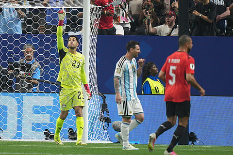 Egypt goalkeeper Mostafa Shoubir (23) reacts after saving a penalty kick by Argentina's Lionel Messi (10) during the World Cup round of 16 soccer match between Argentina and Egypt in Atlanta, Tuesday, July 7, 2026.