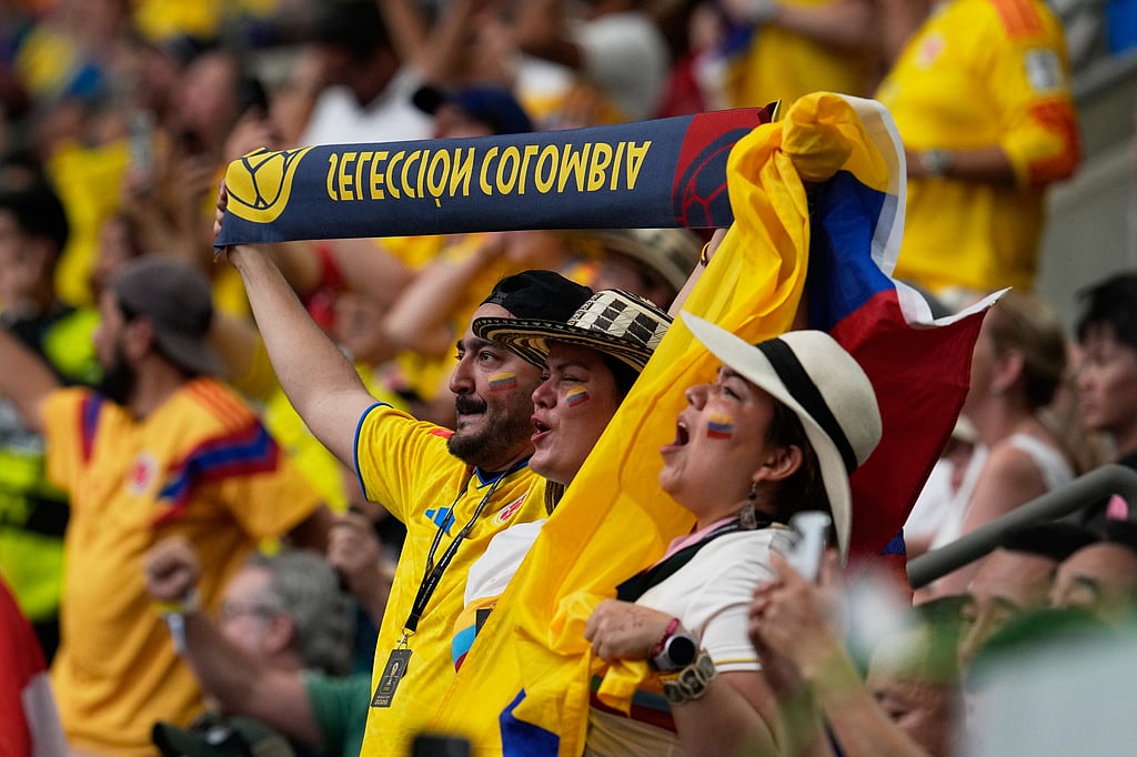 Colombia fans revel before the World Cup round of 16 soccer match against Switzerland in Vancouver