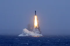 In this photo released by Xinhua News Agency, a long-range ballistic missile bursts out of the sea during a test launched from a Chinese nuclear-powered submarines in the South Pacific on Monday, July 6, 2026. - (Li Xiangchao/Xinhua