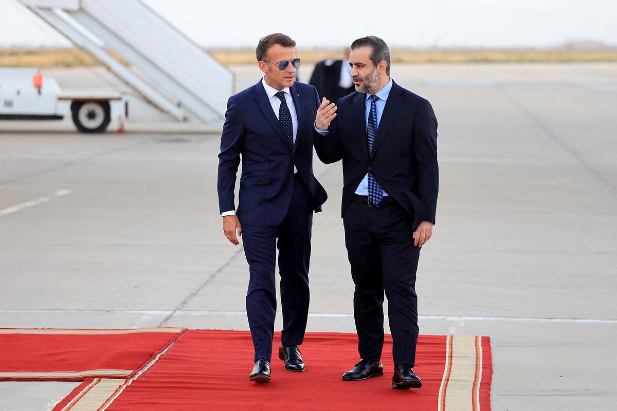 President Macron Arrives For A State Visit To Damascus France s President Emmanuel Macron (L) is welcomed by Syria s Foreign Minister Asaad al-Shaibani (R) as he arrives for a state visit at the Damascus International Airport in Damascus on July 6, 2026.  - IMAGO / ABACAPRESS