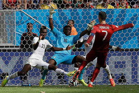 Portugal's Cristiano Ronaldo scores his team's second goal against Ghana during the group G World Cup soccer match in Brasilia, Brazil, June 26, 2014.