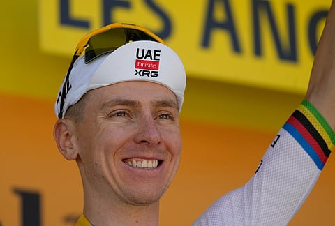 Slovenia's Tadej Pogacar celebrates on the podium after winning the third stage of the Tour de France cycling race with start in Granollers and finish in Les Angles , France, Monday, July 6, 2026. 