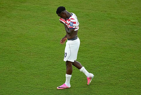 United States' Folarin Balogun (20) reacts to a red card during the World Cup round of 32 soccer match between the United States and Bosnia in Santa Clara, Calif., near San Francisco, Wednesday, July 1, 2026. 