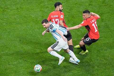 Egypt's Karim Hafez (15) pulls Argentina's Lionel Messi (10) during the World Cup round of 16 soccer match between Argentina and Egypt in Atlanta, Tuesday, July 7, 2026.