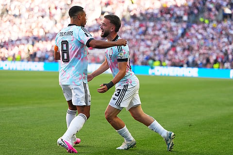 Belgium's Youri Tielemans, left, and Nicolas Raskin celebrates after their team's opening goal against the United States