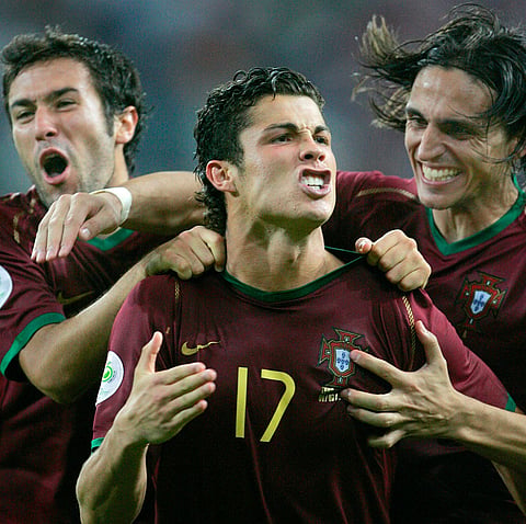 Portugal's Cristiano Ronaldo celebrates with teammates after scoring the winning penalty kick in a shootout against England during the quarterfinal World Cup soccer match in Gelsenkirchen, Germany, July 1, 2006.