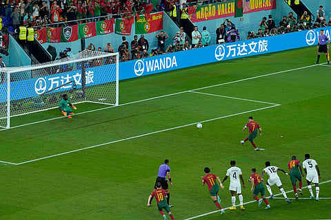 Portugal's Cristiano Ronaldo scores from the penalty spot during the World Cup group H soccer match against Ghana in Doha, Qatar, Nov. 24, 2022.