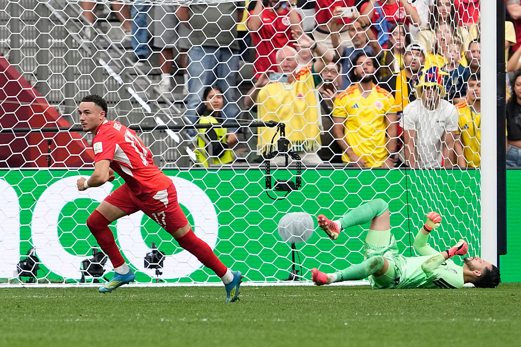 Switzerlands Ruben Vargas, left, reacts after making the game winning goal against Colombias Camilo Vargas during a penalty shootout in the World Cup round of 16 soccer match between Switzerland and Colombia in Vancouver, British Columbia