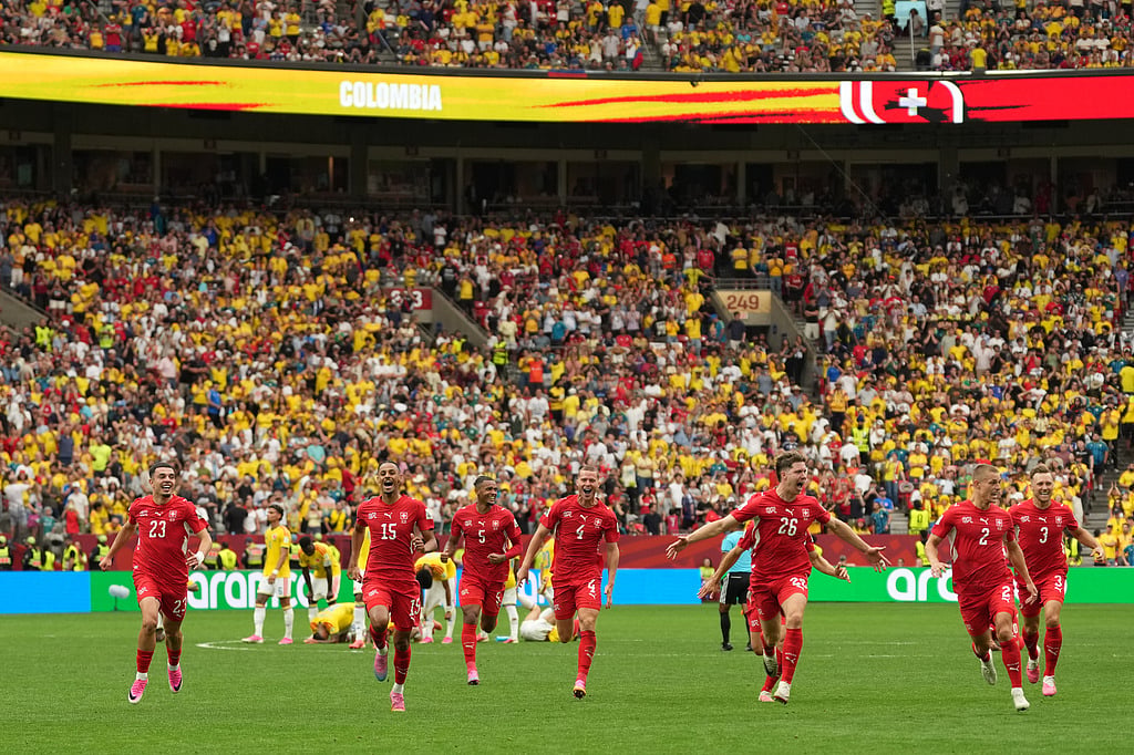 Swiss players celebrate after winning the penalty shootout during the World Cup round of 16 soccer match between Switzerland and Colombia in Vancouver, British Columbia