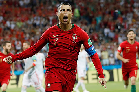 Portugal's Cristiano Ronaldo celebrates his side's opening goal against Spain during the group B match at the World Cup in Sochi, Russia, June 15, 2018.