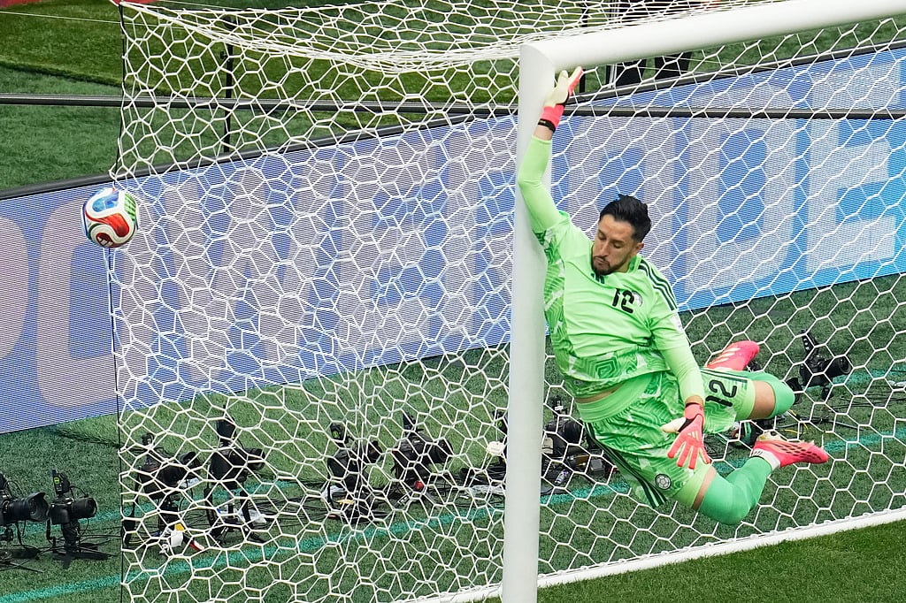 Colombia goalkeeper Camilo Vargas (12) leaps to defend a free kick during the World Cup round of 16 soccer match against Switzerland in Vancouver, British Columbia