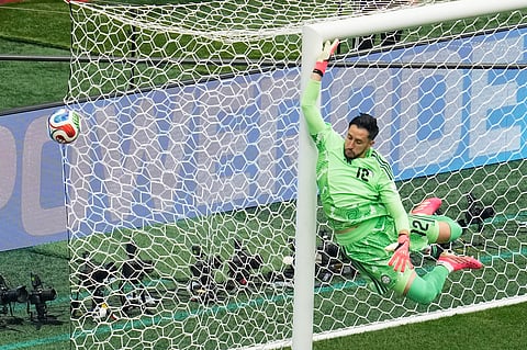 Colombia goalkeeper Camilo Vargas (12) leaps to defend a free kick during the World Cup round of 16 soccer match against Switzerland in Vancouver, British Columbia