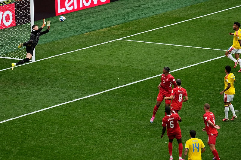Switzerland goalkeeper Gregor Kobel (1) makes a save on a shot by Colombias Gustavo Puerta (14) during the World Cup round of 16 soccer match in Vancouver, British Columbia
