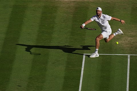 Grigor Dimitrov of Bulgaria returns the ball to Arthur Fery of Britain in their fourth round men's singles match at the Wimbledon Tennis Championships in London.