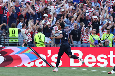 United States' Malik Tillman (17) celebrates after scoring his side's first goal during the World Cup round of 16 soccer match