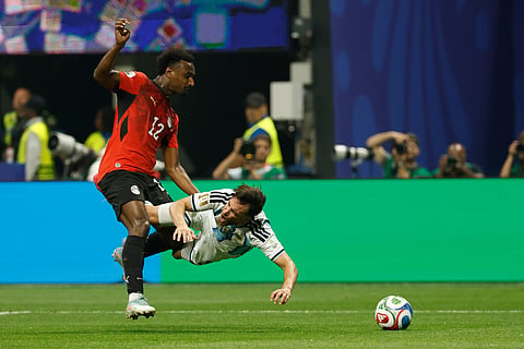 Egypt's Haissem Hassan (12) fouls Argentina's Nicolas Tagliafico (3) during the World Cup round of 16 soccer match between Argentina and Egypt in Atlanta, Tuesday, July 7, 2026.