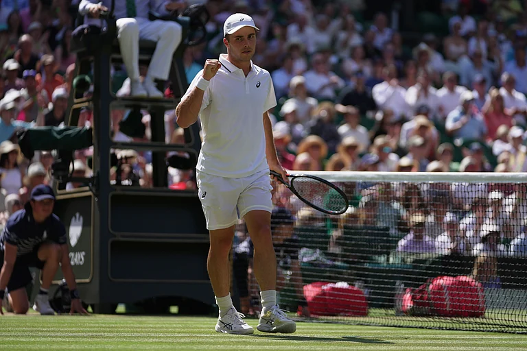 Arthur Fery of Britain reacts to winning a point against Flavio Cobolli of Italy in their quarter-final men's singles match - AP/Brian Inganga