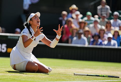 Alexandra Eala of the Philippines reacts afgter falling over during the women's singles fourth round match against Jasmine Paolini of Italy at the Wimbledon Tennis Championships in London, Monday, July 6, 2026.
