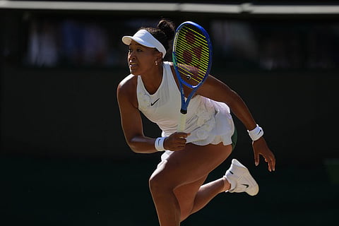 Naomi Osaka of Japan serves against Karolina Muchova of Czech Republic in their quarter-final women's singles match at the Wimbledon Tennis Championships in London.