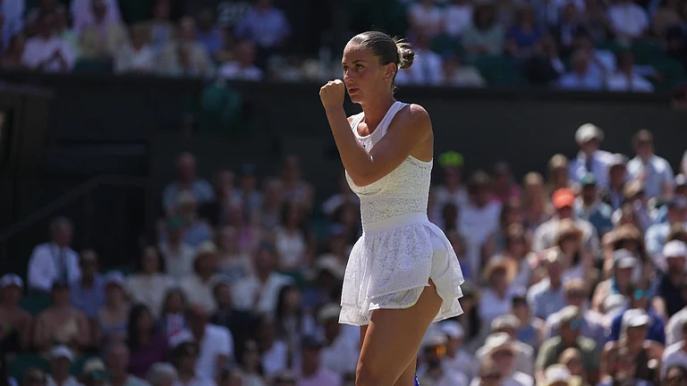 Marta Kostyuk of Ukraine reacts after winning a point against Jasmine Paolini of Italy, in their quarter-final women's singles match at the Wimbledon Tennis Championships in London, Wednesday, July 8, 2026. - (AP Photo/Brian Inganga)