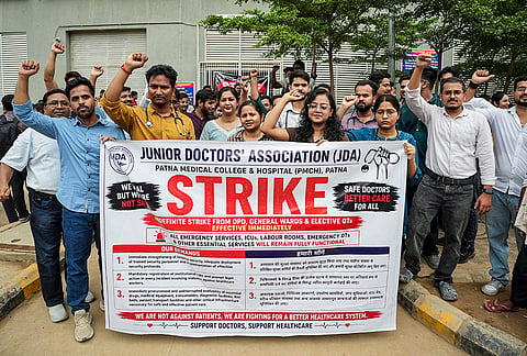 Junior doctors hold a protest during their indefinite strike at Patna Medical College and Hospital (PMCH), demanding enhanced security measures, action against violence against healthcare workers, and revision of stipends, in Patna.