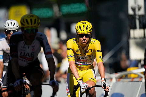 Slovenia's Tadej Pogacar wearing the overall leader's yellow jersey crosses the finish line of the fourth stage of the Tour de France cycling race with start in Carcassonne and finish in Foix, France.