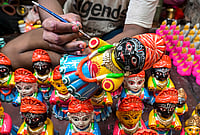| Photo: PTI : An artisan makes idols of Lord Jagannath, Balabhadra and Goddess Subhadra ahead of the Rath Yatra festival, in Nadia, West Bengal.