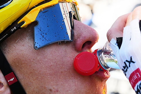 Slovenia's Tadej Pogacar wearing the overall leader's yellow jersey drinks after the fourth stage of the Tour de France cycling race with start in Carcassonne and finish in Foix, France.