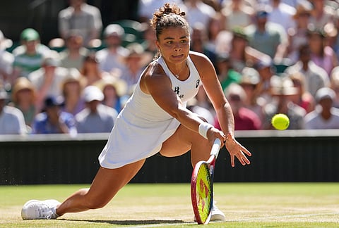 Jasmine Paolini of Italy plays a return during the women's singles fourth round match against Alexandra Eala of the Philippines at the Wimbledon Tennis Championships in London, Monday, July 6, 2026.