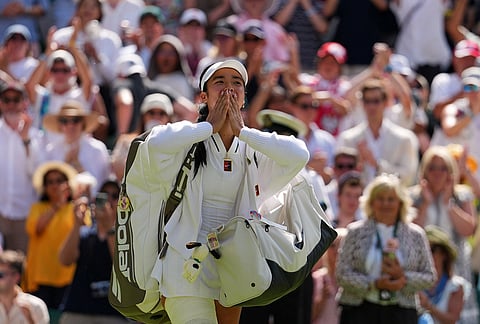Alexandra Eala of the Philippines blows kisses to the crowd after losing the women's singles fourth round match against Jasmine Paolini of Italy at the Wimbledon Tennis Championships in London, Monday, July 6, 2026.