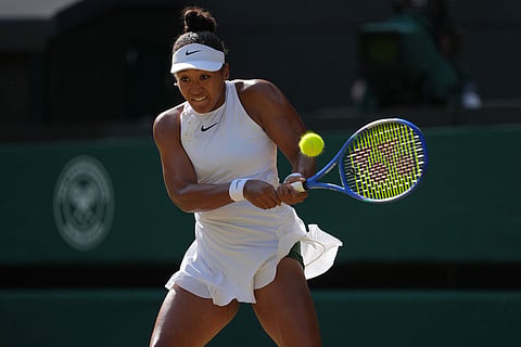 Naomi Osaka of Japan returns the ball to Karolina Muchova of Czech Republic in their quarter-final women's singles match at the Wimbledon Tennis Championships in London.