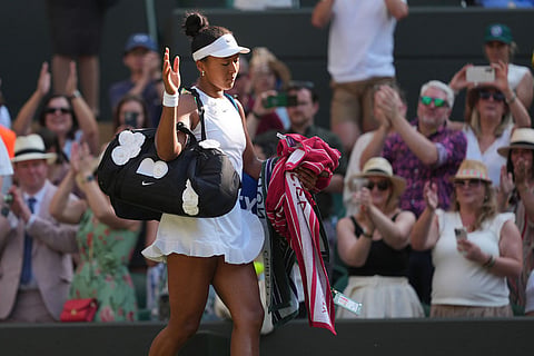 Naomi Osaka of Japan leaves after losing to Karolina Muchova of Czech Republic in their quarter-final women's singles match at the Wimbledon Tennis Championships in London.
