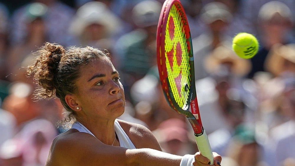 | Photo: AP/Kirsty Wigglesworth : Jasmine Paolini of Italy plays a return during the women's singles fourth round match against Alexandra Eala of the Philippines at the Wimbledon Tennis Championships in London, Monday, July 6, 2026.
