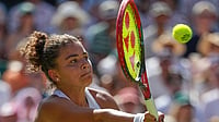 | Photo: AP/Kirsty Wigglesworth : Jasmine Paolini of Italy plays a return during the women's singles fourth round match against Alexandra Eala of the Philippines at the Wimbledon Tennis Championships in London, Monday, July 6, 2026.
