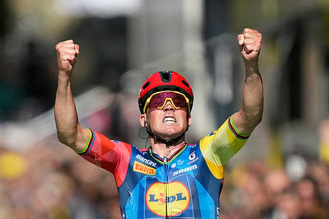 Denmark's Mads Pedersen celebrates as he crosses the finish line to win the fourth stage of the Tour de France cycling race with start in Carcassonne and finish in Foix, France.