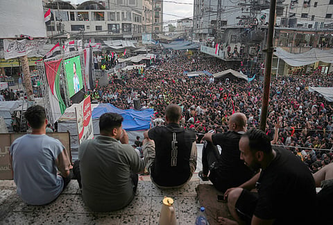 Palestinians watch a live broadcast of the World Cup round of 16 soccer match between Argentina and Egypt in Nuseirat, central Gaza Strip.
