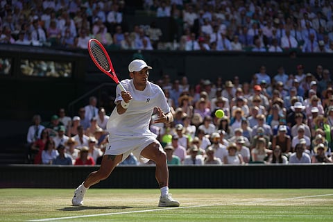 Flavio Cobolli of Italy returns the ball to Arthur Fery of Britain in their quarter-final men's singles match at the Wimbledon Tennis Championships in London.
