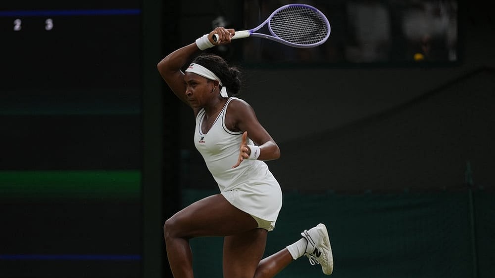 Coco Gauff of the United States returns the ball to Belinda Bencic of Switzerland in their fourth round women's singles match at the Wimbledon Tennis Championships in London, Sunday, July 5, 2026. - | Photo: AP/Kin Cheung