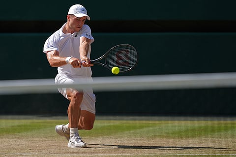 Arthur Fery of Britain returns the ball to Flavio Cobolli of Italy in their quarter-final men's singles match at the Wimbledon Tennis Championships in London.