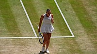 | Photo: AP/Maja Smiejkowska : Marta Kostyuk of Ukraine reacts after winning a point against Jasmine Paolini of Italy in their quarter-final women's singles match at the Wimbledon Tennis Championships in London.
