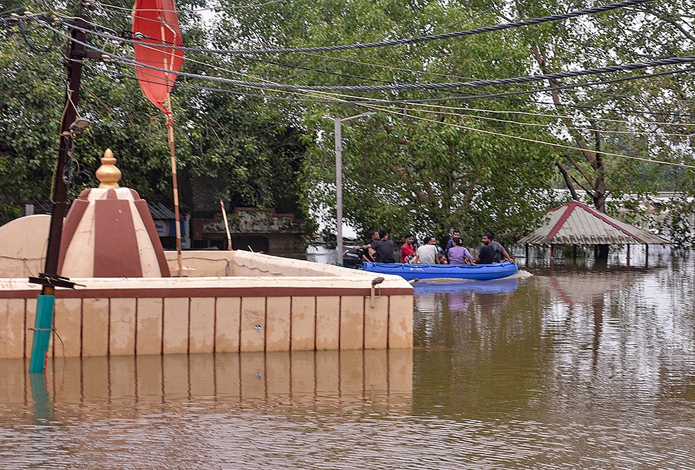 A submerged temple in floodwater after rainfall