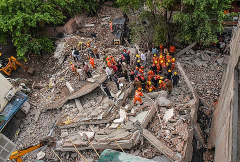 NDRF and other personnel conduct a rescue operation at the site after a three-storey under-construction house collapsed at Rohini amid heavy rainfall, in New Delhi, Wednesday, July 8, 2026. Two people were pulled out of the rubble in the search and rescue efforts. 