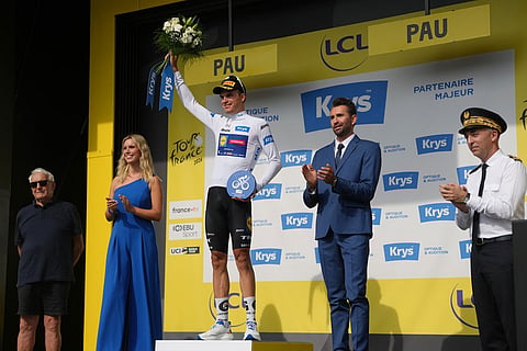 Mathias Vacek of the Czech Republic, wearing the best young rider's white jersey celebrates on the podium after the fifth stage of the Tour de France cycling race with start in Lannemezan and finish in Pau, France.